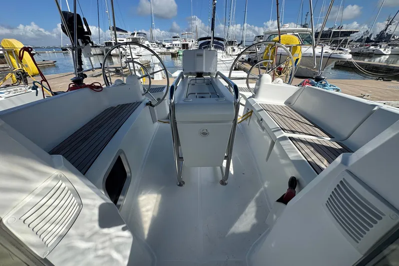 Sea Ranch II Yacht Photos Pics 2018 Jeanneau Sun Odyssey 389 sailboat cockpit with dual steering wheels at marina.