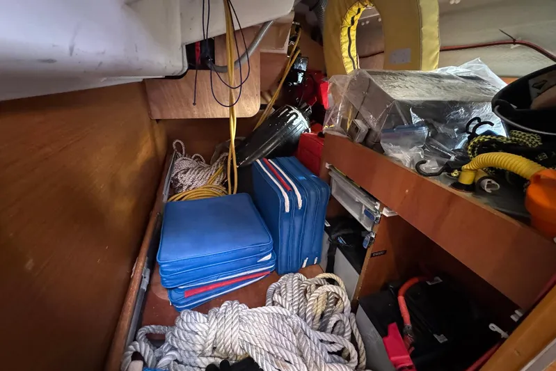 Sea Ranch II Yacht Photos Pics Storage area in 2018 Jeanneau Sun Odyssey 389 sailboat with ropes and equipment.