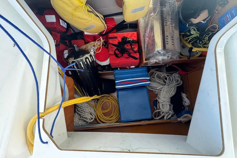 Sea Ranch II Yacht Photos Pics Storage compartment of 2018 Jeanneau Sun Odyssey 389 with ropes and safety gear.