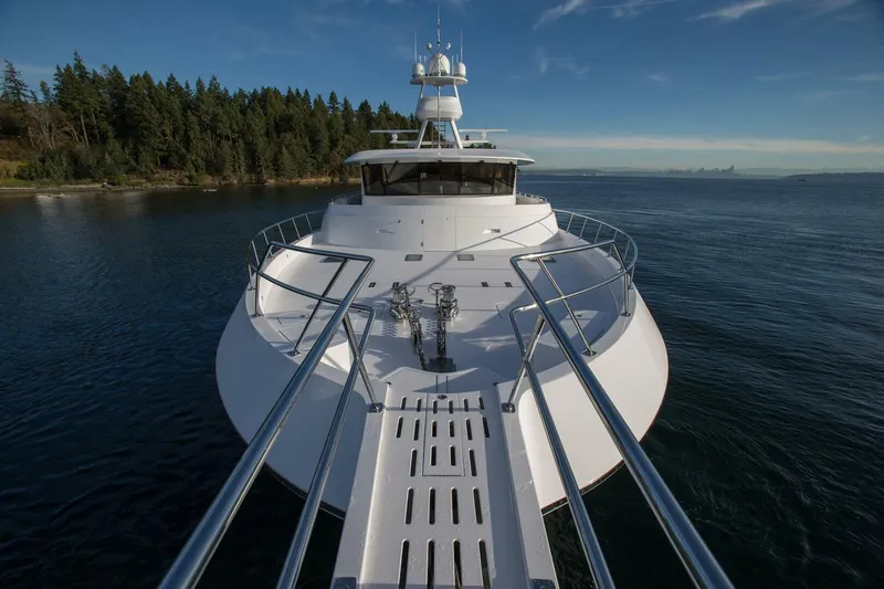 Cazador Yacht Photos Pics 2019 Nordlund Expedition Yachtfisher on calm waters with forested shoreline.