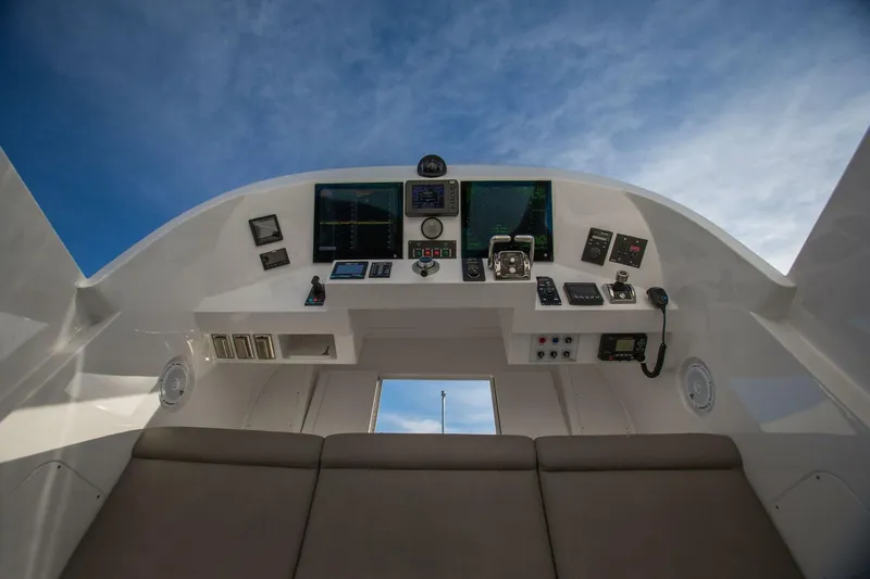 Cazador Yacht Photos Pics 2019 Nordlund Expedition Yachtfisher cockpit with advanced navigation systems under a clear sky.