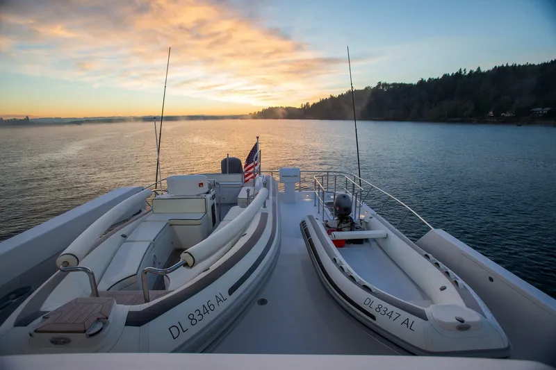 Cazador Yacht Photos Pics 2019 Nordlund Expedition Yachtfisher at sunset with two dinghies on deck.