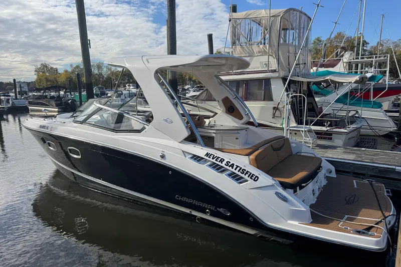  Yacht Photos Pics 2023 Chaparral 347 SSX boat docked at marina, sleek design, luxury features.