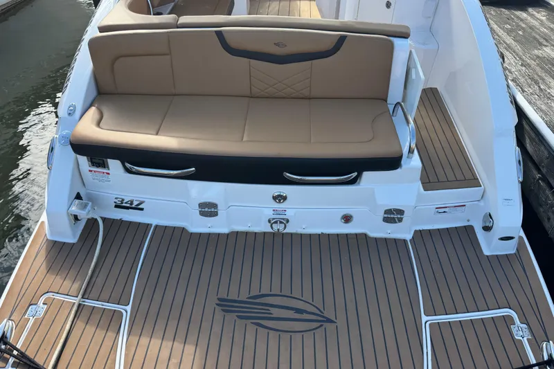  Yacht Photos Pics 2023 Chaparral 347 SSX boat with tan seating and teak-style deck.