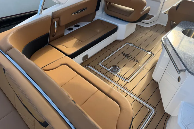  Yacht Photos Pics 2023 Chaparral 347 SSX boat interior with tan seating and sleek flooring design.