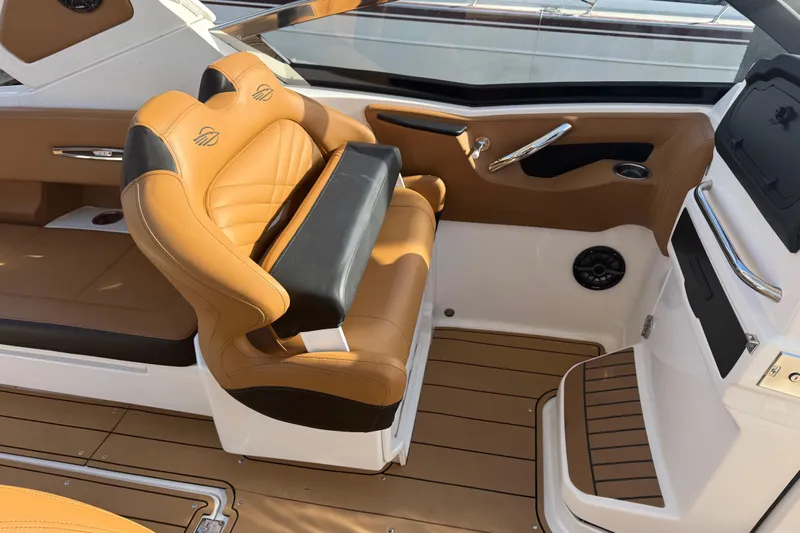  Yacht Photos Pics 2023 Chaparral 347 SSX boat interior with tan leather seating and modern design.