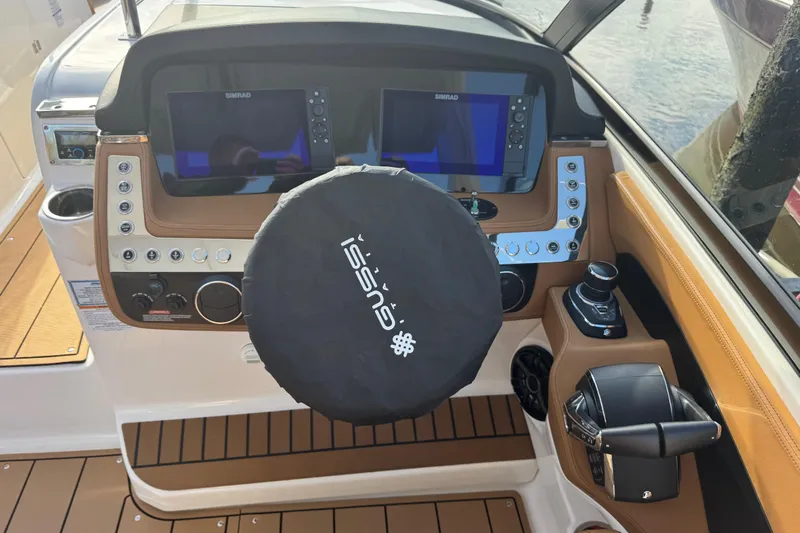  Yacht Photos Pics 2023 Chaparral 347 SSX boat dashboard with dual Simrad displays and Gussi steering wheel.