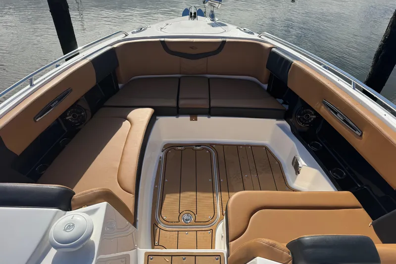 Yacht Photos Pics 2023 Chaparral 347 SSX boat interior with tan seating and wood flooring.