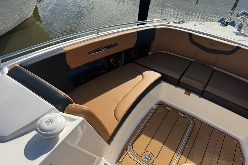  Yacht Photos Pics Luxurious seating area on 2023 Chaparral 347 SSX boat, featuring tan and black upholstery.