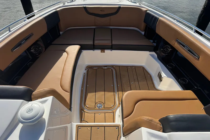  Yacht Photos Pics 2023 Chaparral 347 SSX boat interior with tan seating and wood flooring.