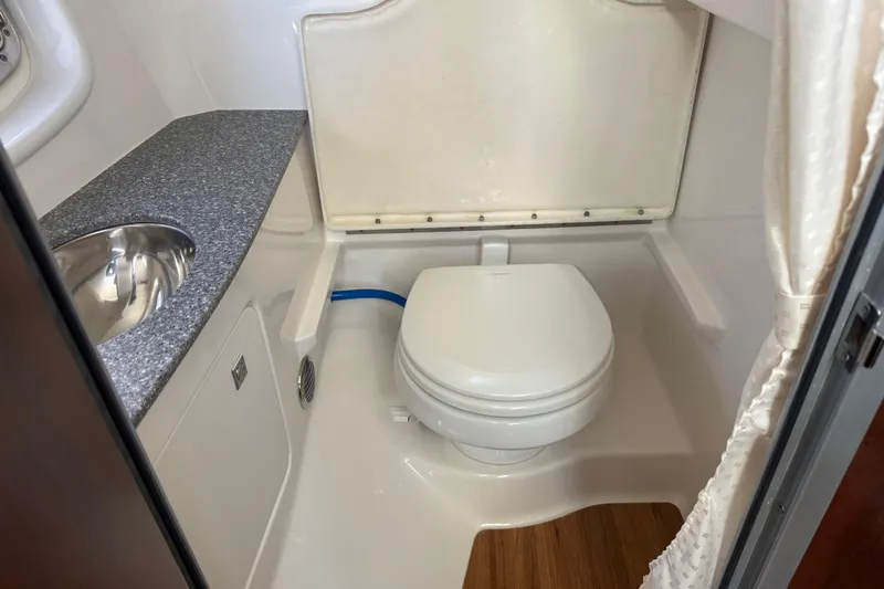  Yacht Photos Pics 2023 Chaparral 347 SSX boat bathroom with toilet and sink.