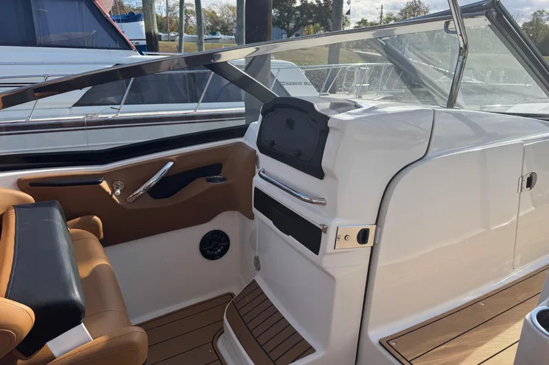  Yacht Photos Pics 2023 Chaparral 347 SSX boat interior with tan seating and sleek dashboard design.