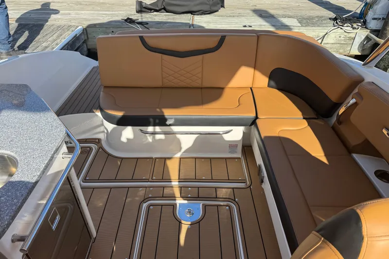  Yacht Photos Pics Luxurious seating area on 2023 Chaparral 347 SSX boat with tan upholstery.
