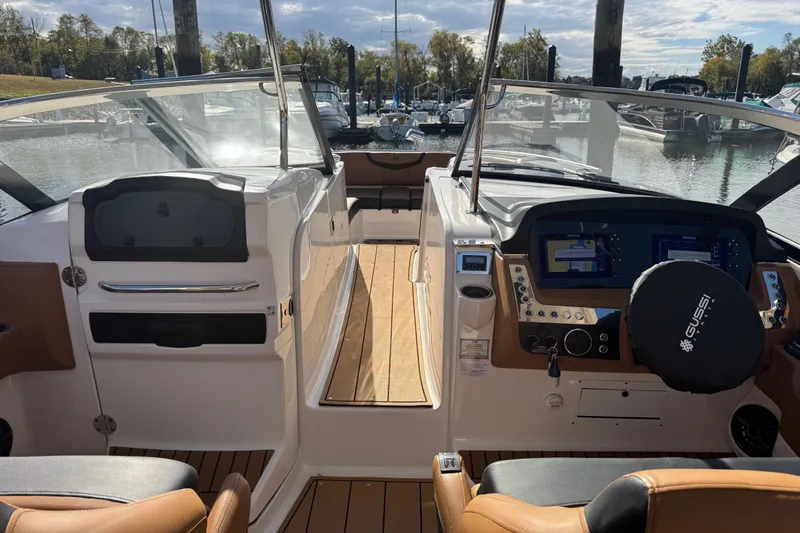  Yacht Photos Pics 2023 Chaparral 347 SSX boat interior with modern dashboard and wood flooring.