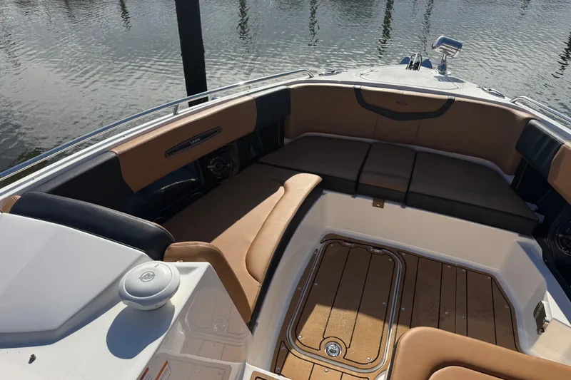  Yacht Photos Pics 2023 Chaparral 347 SSX boat interior with tan seating and wood flooring.