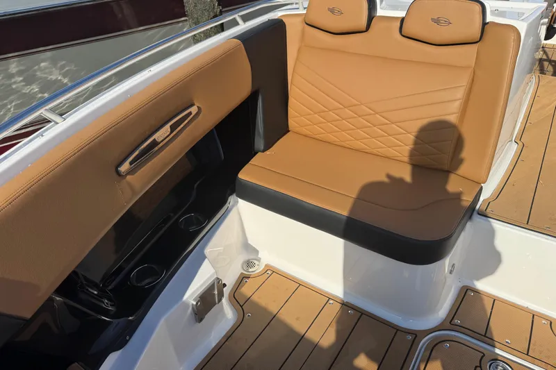  Yacht Photos Pics 2023 Chaparral 347 SSX boat interior with tan leather seating and cup holders.
