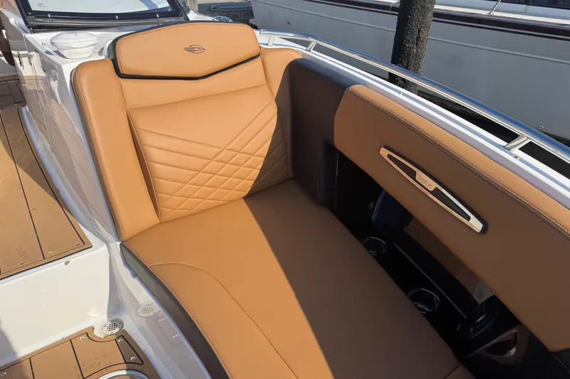  Yacht Photos Pics Luxurious tan seating on 2023 Chaparral 347 SSX boat, featuring elegant stitching and modern design.