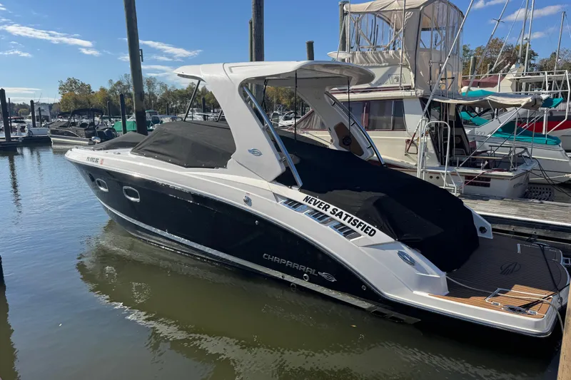  Yacht Photos Pics 2023 Chaparral 347 SSX boat docked at marina, covered and ready for adventure.