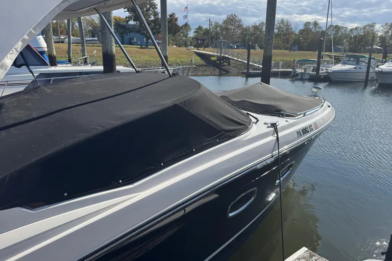  Yacht Photos Pics 2023 Chaparral 347 SSX boat docked at marina with black cover.