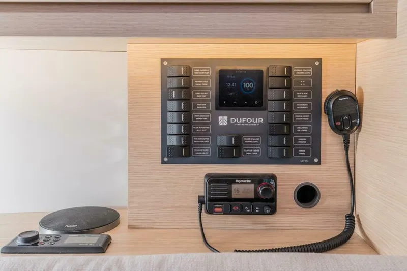 In Stock #108 Yacht Photos Pics Control panel of 2025 Dufour 37 yacht with communication equipment.