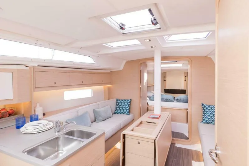 In Stock #108 Yacht Photos Pics 2025 Dufour 37 yacht interior with modern kitchen, cozy seating, and natural light.