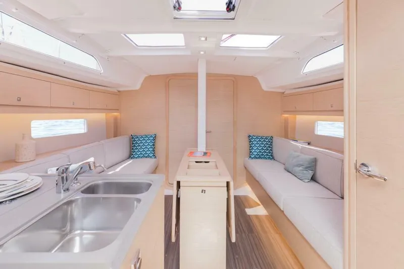 In Stock #108 Yacht Photos Pics Modern interior of 2025 Dufour 37 yacht with sleek design and comfortable seating.