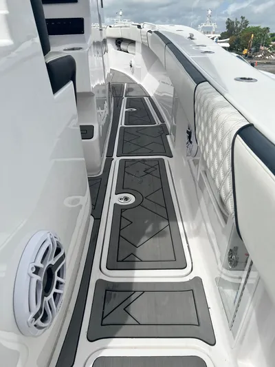  Yacht Photos Pics 2021 Streamline 34CC boat deck with cushioned seating and marine speakers.