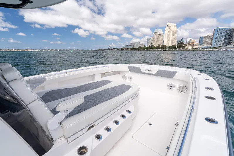 Tuna Colada Yacht Photos Pics Invincible 35 Catamaran 2020 on water with city skyline in background.