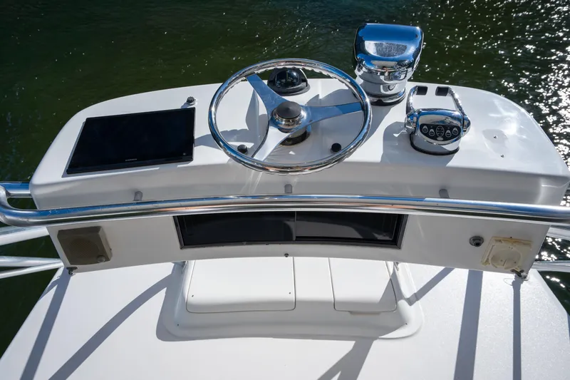 Reel Steel Yacht Photos Pics Helm of 2004 Cabo 35 Express boat with steering wheel and controls.