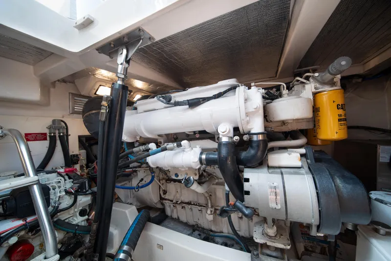 Reel Steel Yacht Photos Pics Engine room of a 2004 Cabo 35 Express boat, showcasing detailed machinery and components.