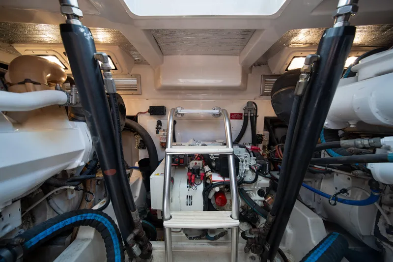 Reel Steel Yacht Photos Pics Engine room of 2004 Cabo 35 Express boat, showcasing mechanical components and equipment.
