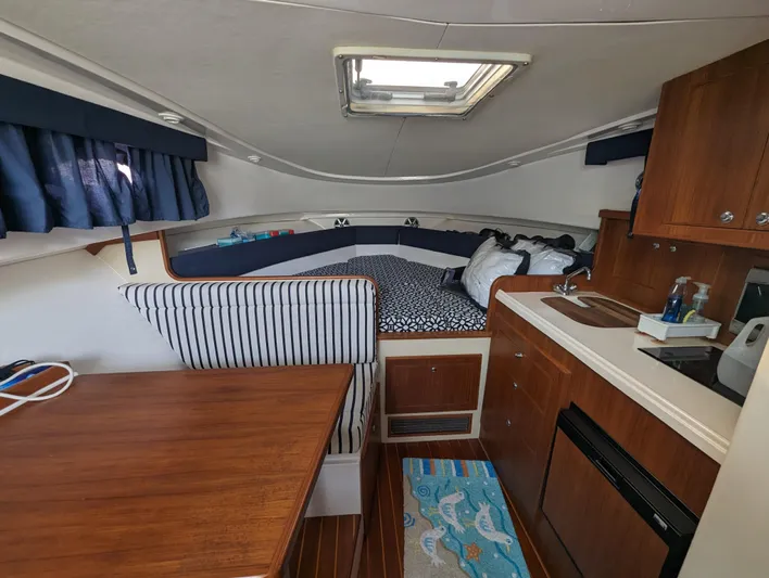 Boatanicals Yacht Photos Pics Interior of 2016 Stamas Aegean boat with cozy seating and kitchenette.