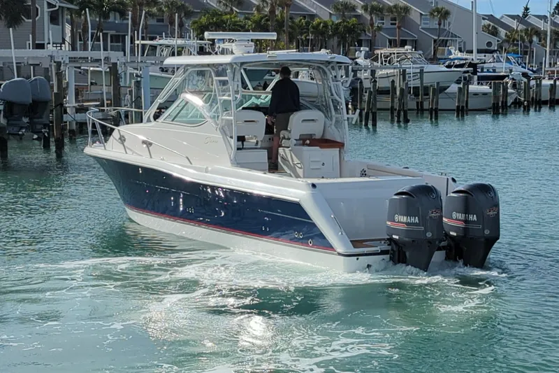 Boatanicals Yacht Photos Pics 2016 Stamas Aegean boat with twin Yamaha engines in a marina.