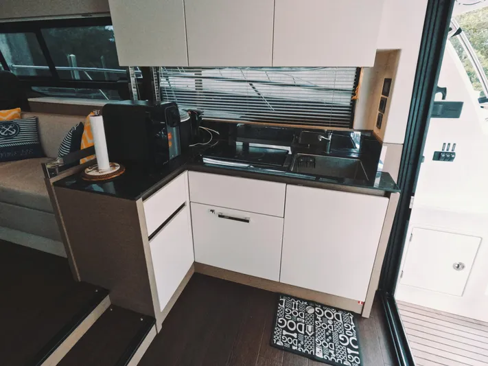  Yacht Photos Pics Modern kitchen interior on 2020 Prestige 460 yacht with sleek cabinetry and appliances.