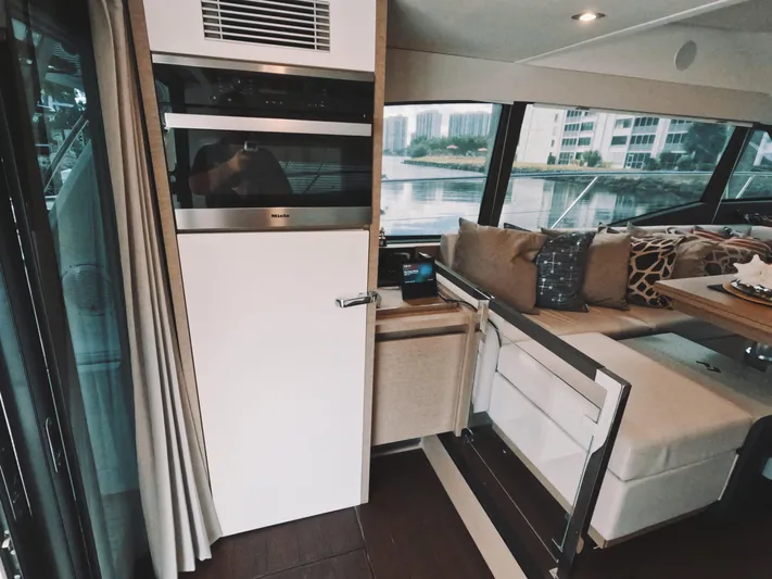  Yacht Photos Pics Luxurious interior of 2020 Prestige 460 yacht with modern seating and large windows.