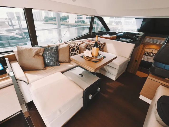  Yacht Photos Pics Luxurious interior of 2020 Prestige 460 yacht with elegant seating and champagne setup.