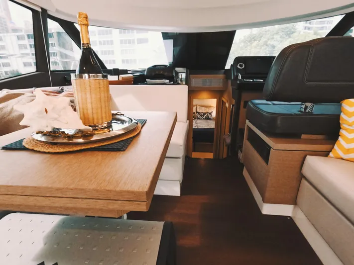  Yacht Photos Pics Luxurious interior of 2020 Prestige 460 yacht with elegant dining setup.