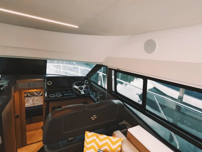  Yacht Photos Pics Interior of 2020 Prestige 460 yacht, featuring helm station and modern design elements.
