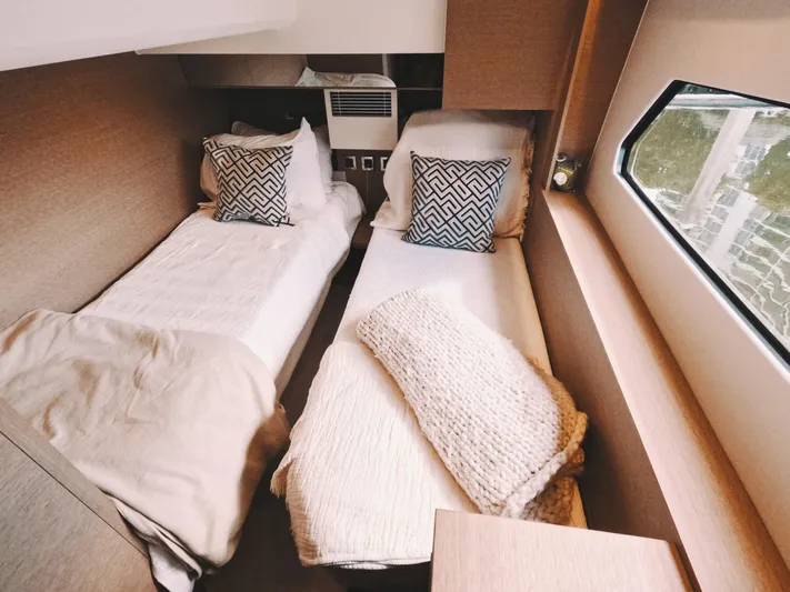  Yacht Photos Pics Cozy twin cabin in 2020 Prestige 460 yacht with modern decor and window view.