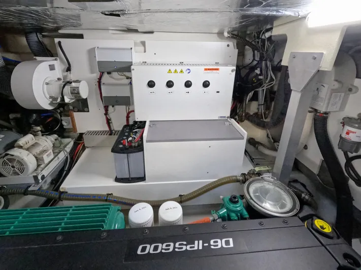  Yacht Photos Pics Engine room of 2020 Prestige 460 yacht with mechanical components and control panel.