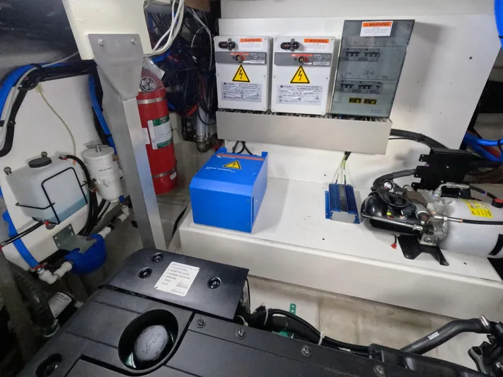  Yacht Photos Pics Engine room of 2020 Prestige 460 yacht with electrical panels and safety equipment.