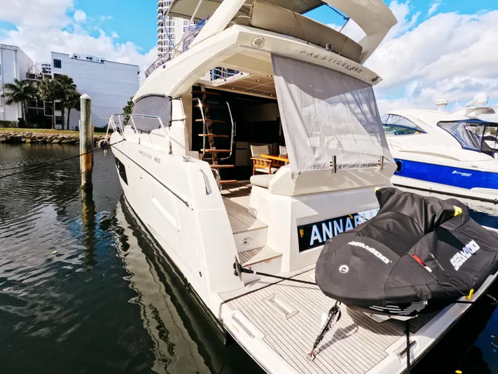  Yacht Photos Pics 2020 Prestige 460 yacht docked, featuring spacious deck and modern design.