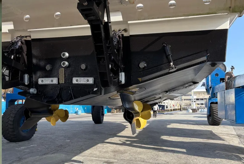  Yacht Photos Pics Underneath view of a 2020 Prestige 460 boat, showcasing propellers and hull details.