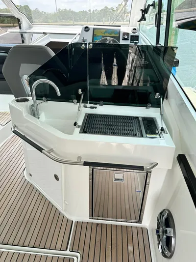 De-sea Yacht Photos Pics 2021 Beneteau GT 32 yacht kitchenette with sink and grill on teak deck.