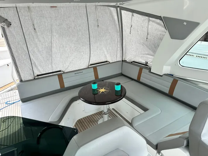 De-sea Yacht Photos Pics 2021 Beneteau GT 32 yacht interior with cozy seating and table.