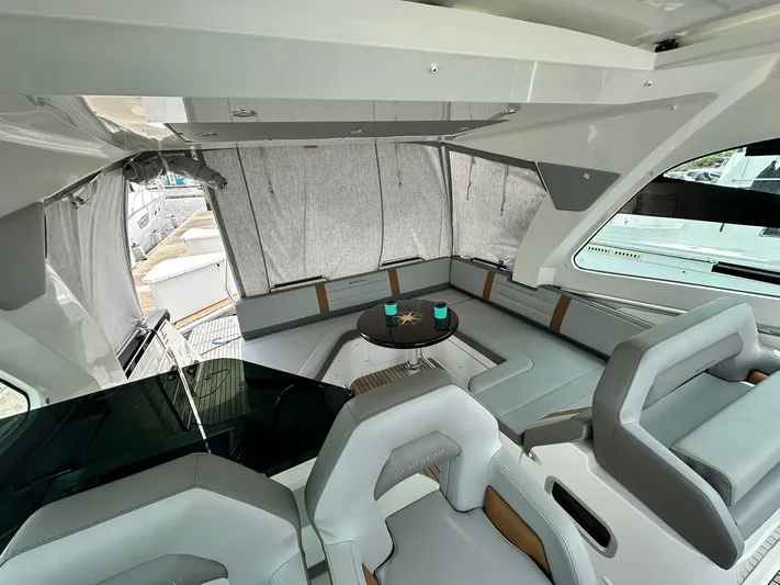De-sea Yacht Photos Pics Interior of 2021 Beneteau GT 32 yacht with modern seating and table.