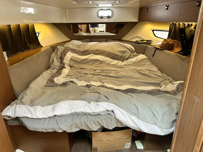 De-sea Yacht Photos Pics Cozy cabin interior of 2021 Beneteau GT 32 with comfortable bedding and ambient lighting.
