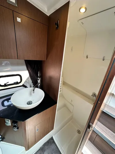 De-sea Yacht Photos Pics 2021 Beneteau GT 32 yacht bathroom with modern sink and shower.