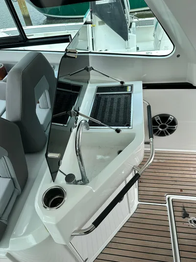 De-sea Yacht Photos Pics 2021 Beneteau GT 32 boat interior with sleek seating and modern controls.