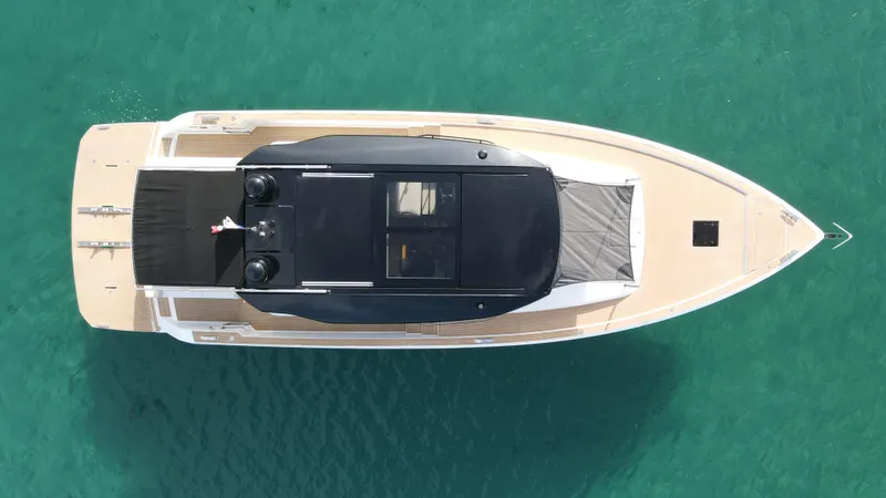 Kayenne Yacht Photos Pics Aerial view of 2023 Pardo Yachts GT 52 on turquoise water.